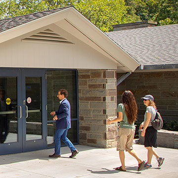Visitors approaching the front entrance of the Welcome Center